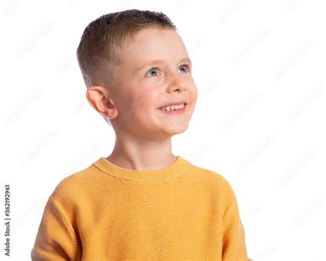 Portrait Of A Cute 6 Year Old Boy On A White Background Side View