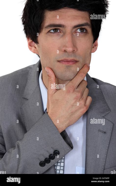 Pensive Businessman Rubbing His Chin Stock Photo Alamy