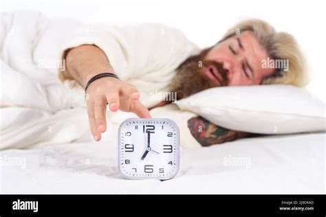 Morning Awakening Sleepy Bearded Man Turning Off Alarm Clock Male In