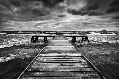 Old Wooden Jetty Pier During Storm On The Sea Dramatic Sky With