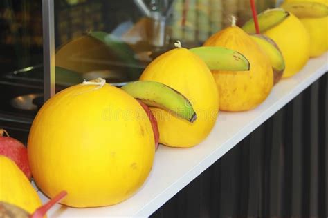 Summer Fruit Melon And Bananas In The Window Of The Seller Stock Photo