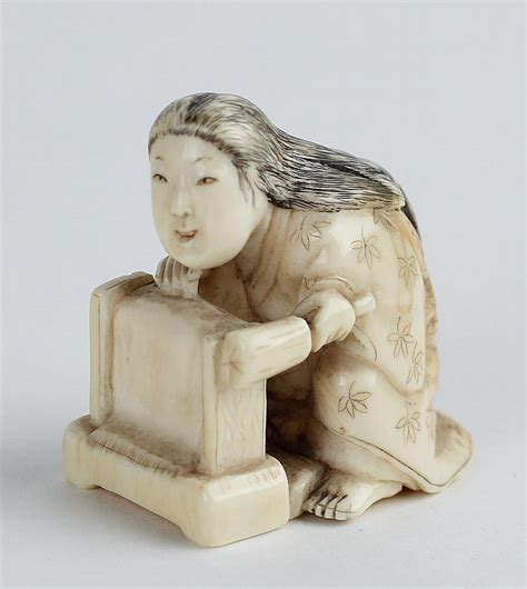 lot a late 19th century japanese carved ivory netsuke of a woman weaving height 1 1 2 in 4 cm