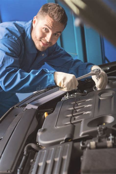 Handsome Hardworking Mechanic Repairing A Car Stock Image Image Of