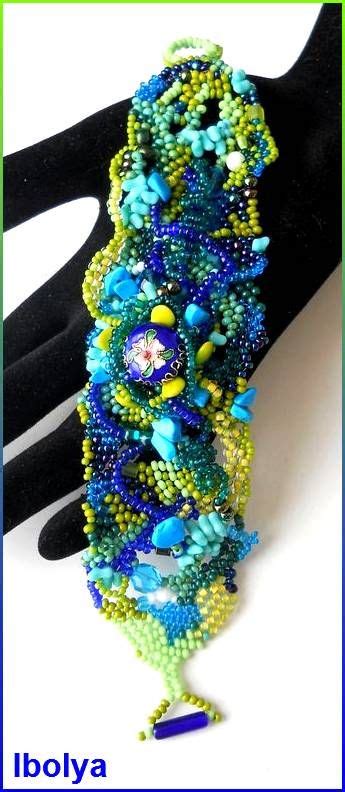 The Beaded Bracelet Is On Display In Front Of A Mannequin S Hand
