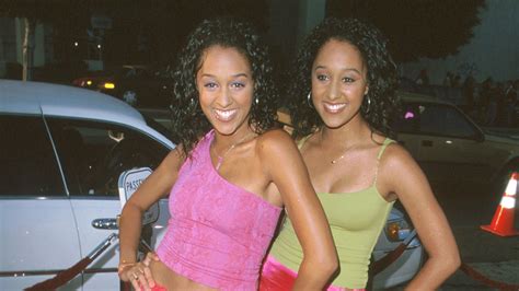 great outfits in fashion history tia and tamera mowry in coordinating hot pink slip skirts
