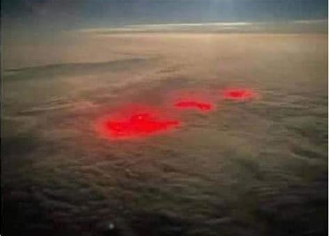 Pilot Spots Mysterious Red Glow Below Clouds Over The Atlantic Ocean