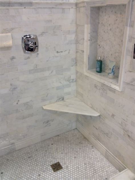 Each of our tiles are sourced from the same slabs, ensuring a. love this shower with marble hex tile floor & nook and ...