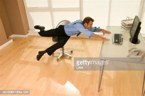 Businessman Falling From Chair Laughing Elevated View Photo Getty Images