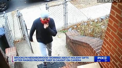 Masked Man Caught On Camera Stealing Packages In Brooklyn