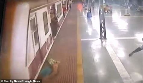 Shocking Moment Woman Is Hit By Train And Dragged Along The Platform