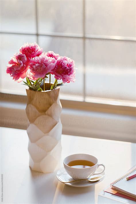 Vase Of Peonies With Cup Of Tea In Morning Light By Stocksy Contributor Kelly Knox Stocksy