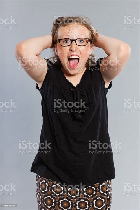 Happy Funny Teenage Girl With Curly Blonde Hair Wearing Glasses Stock