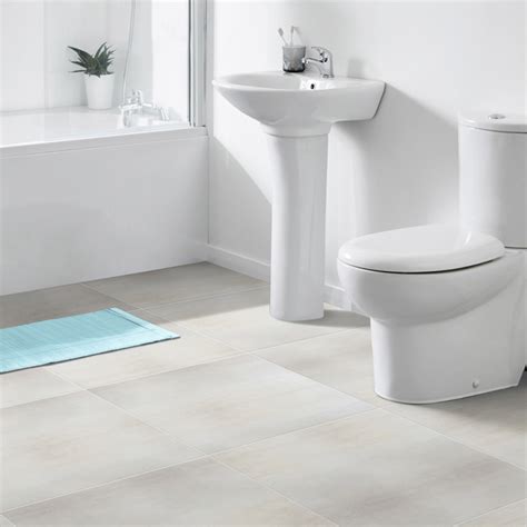 Contrast floor tile with other bathroom surfaces to add interest. Shanon White Glazed Porcelain Floor Tile