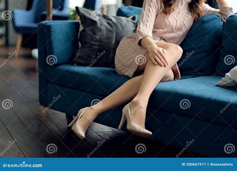 Young Woman Is Lying On A Couch Beautiful Girl Is Resting On The Sofa At Home Stock Image