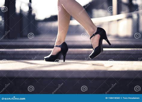 Woman Walking In High Heels In Urban City Street In Summer Chic