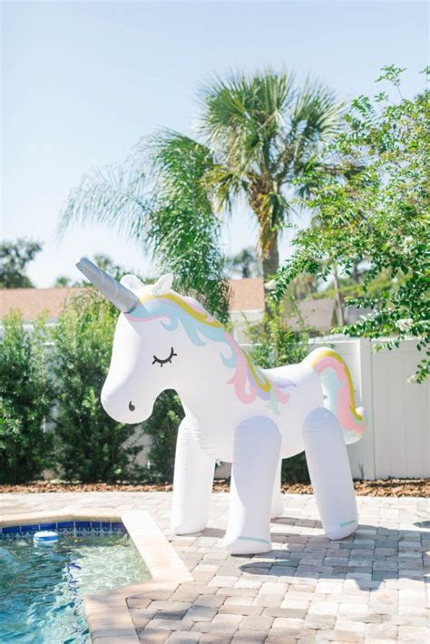 A Large Inflatable Unicorn Next To A Swimming Pool