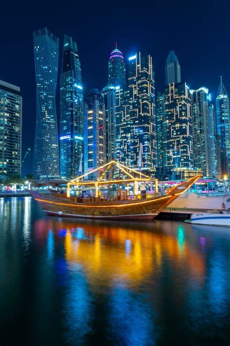 Night View To Dubai Marina Panorama And Traditional Wooden Uae Boat
