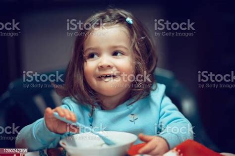 Cute Baby Girl Eating Porridge Stock Photo Download Image Now Baby