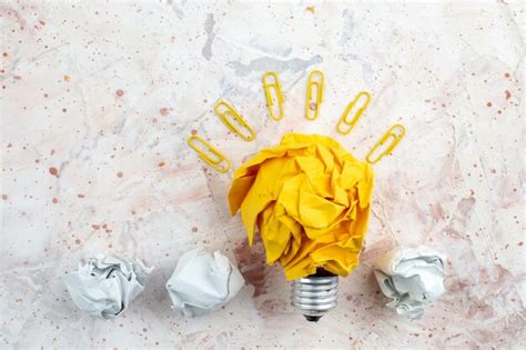 Premium Photo Top View Idea Light Bulb Concept With Crumpled Yellow