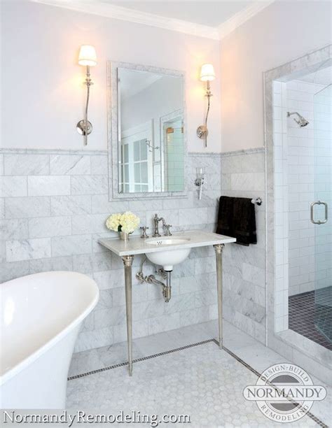 A comfortable bathroom is a key source of tranquility in your home. 6x12 marble tile wainscotting framed wiht marble chair ...