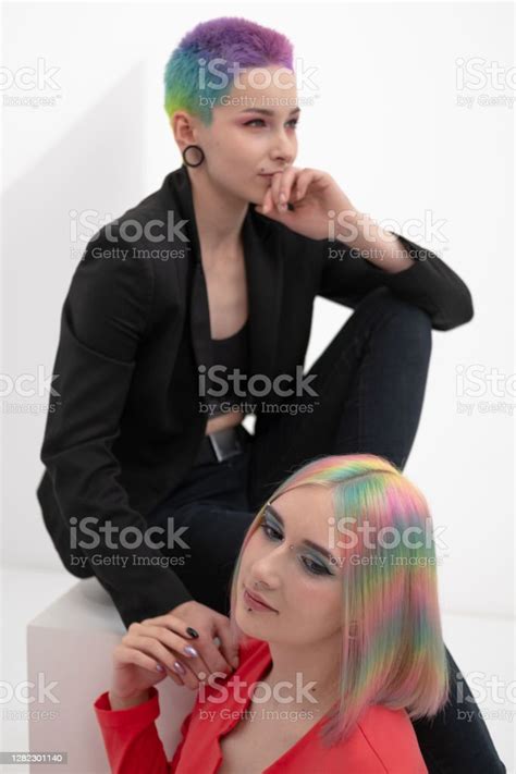Young Lesbian Woman Couple With Vivd Colored Short Hair And Jackets