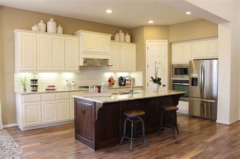 Walnut hardwood flooring has a rich history. White painted kitchen cabinets with cabinet doors by Taylorcraft Cabinet Door Company, walnut ...