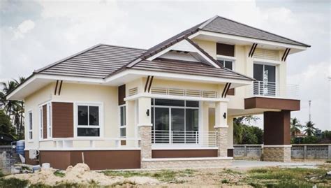 This option comes in a combination of immaculate white and tan exterior finish. Thai-style Three-bedroom 1.5-storey House Design - Cool ...