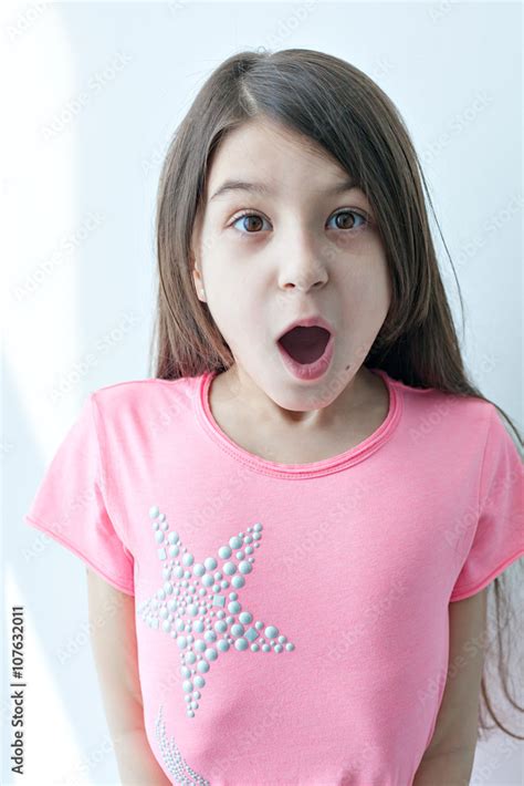 Foto Stock Little Girl Making A Funny Face Adobe Stock