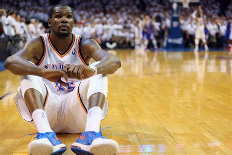 Download Kevin Durant Sitting On Basketball Court Wallpaper
