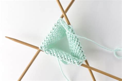 When you knit a smaller piece in the round like a sock or a cuff, and you don't want to use or you don't have double pointed needles, you can knit in the round using two circular pull needles through to the side where you have the working yarn. How to Knit in the Round with Four Needles - Knitwise Girl