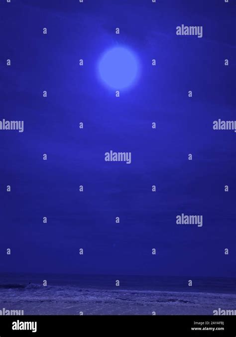 Full Moon Over Water Stock Photo Alamy