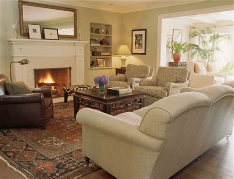 Warm blankets and comforting family photos decorate a small living room. Cozy Living Room Ideas