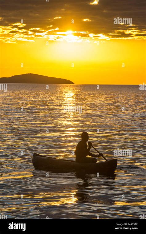 Backlight Of A Fisherman In His Canoe On Lake Malawicape Maclear