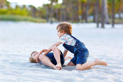 Two Little Kids Boys Having Fun On Tropical Beach Happy Best Friends