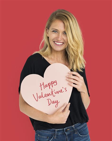 cheerful woman holding a valentine s free photo rawpixel