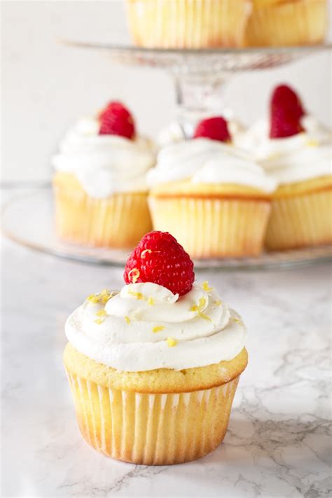 Spoon the batter into the muffin cups, filling them halfway. Lemon Raspberry-Filled Cupcakes with White Chocolate ...