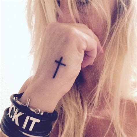 This tattoo is a great representation of catechism and conviction. Hand tattoo black cross | Tattoos, Hand tattoos, Black tattoos