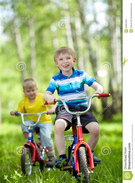 Little Children Riding Their Bikes Stock Images Image