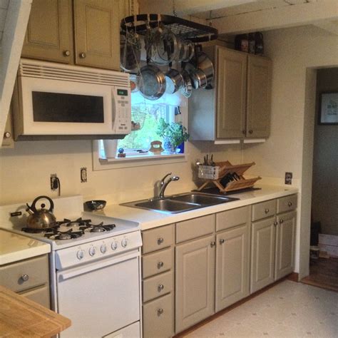 There are two ways to get great looking cabinets without completely replacing them. Kitchen face-lift in progress: Painted cabinets, painted ...