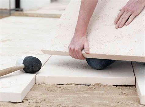 How To Lay Slabs On Soil Sand Grass And Concrete Checkatrade