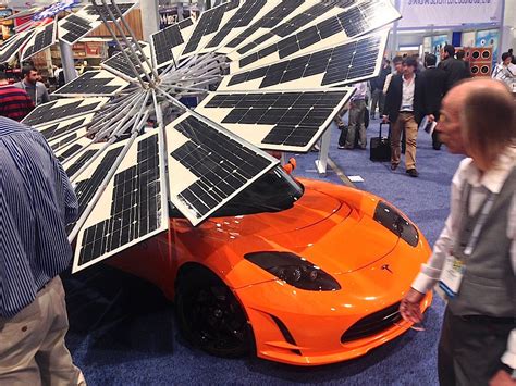 Look At This Tesla With A Giant Solar Panel Umbrella Coming Out Of Its