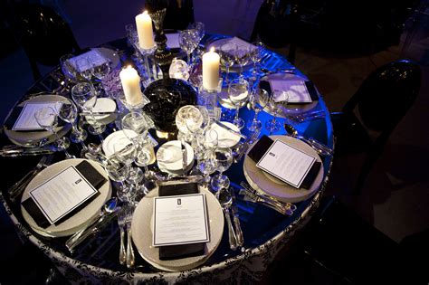 Wedding table setting ideas for an especially glamorous décor include white tablecloths with black runners, red napkins or chair ties. Hmm maybe we could make 2012 a black and white affair ...
