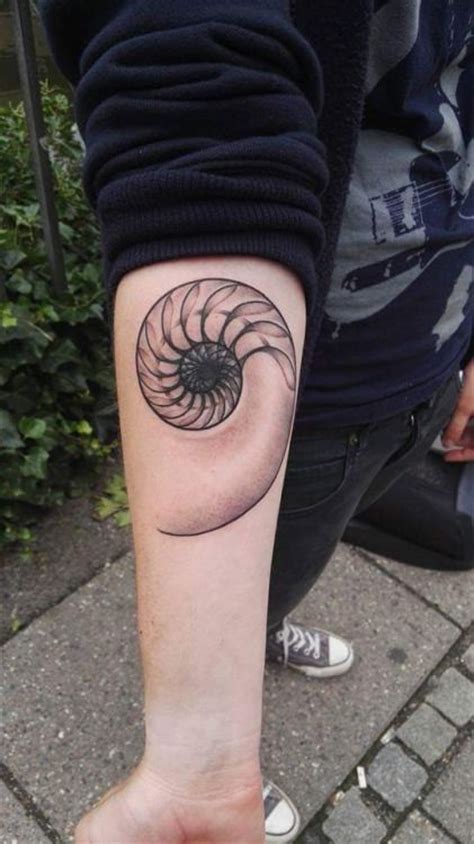 Grey ink taj mahal tattoo on right shoulder. nautilus shell tattoo. | Shell tattoos, Dna tattoo, Body ...