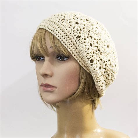A Mannequin Head Wearing A White Crochet Hat