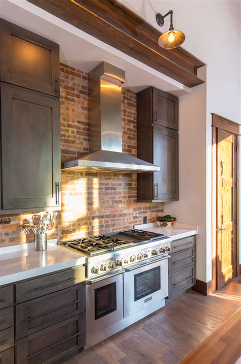 Brick Kitchen With Stainless Steel Appliances And Hood Kitchen