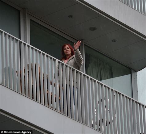 Moment Woman Is Rescued From Balcony Because She Was Locked Out Daily