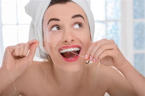 Woman Cleaning Teeth With Floss Stock Image Image Of Attractive