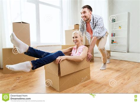Couple With Cardboard Boxes Having Fun At New Home Stock Image Image