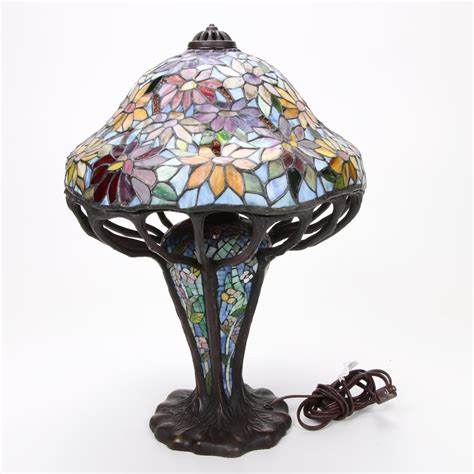 Tiffany Style Bronze And Slag Glass Lamp With Illuminated Bulbular Base