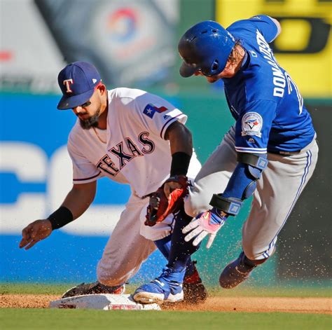 Josh Donaldson Slides In Safely On A Double In The Third Inning As